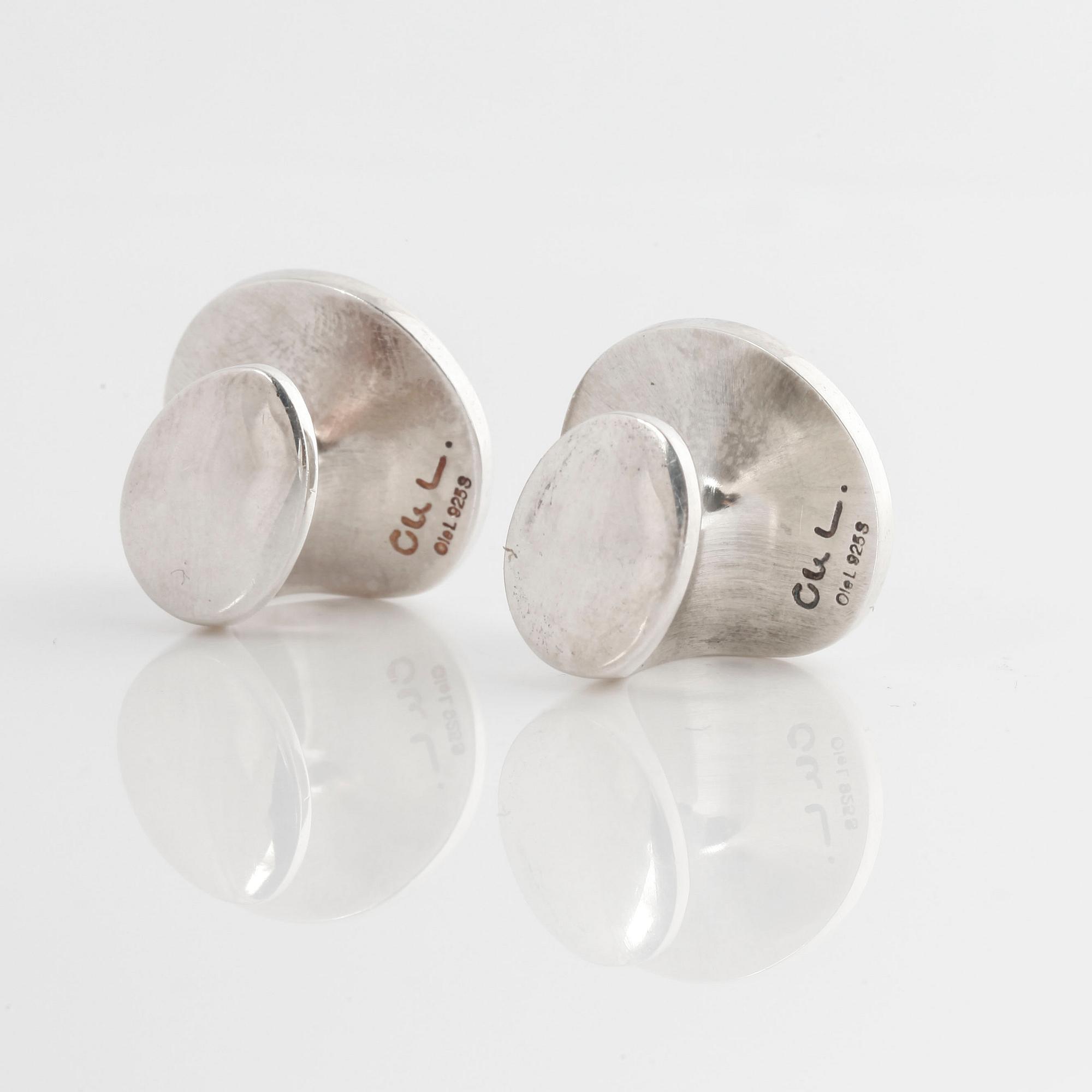 A pair of cufflink, by Ole Lynggaard.