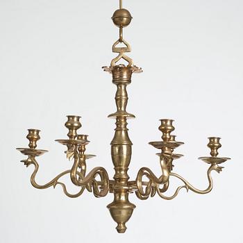 A six-light 18/19th century brass chandelier.