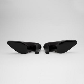 CHANEL, a pair of black leather lady's shoes.