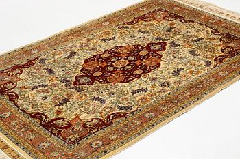 A rug, semi-antique, silke Hereke, signed, ca 184,5 x 118 cm.