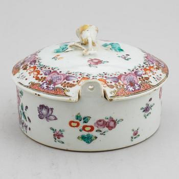 A famille rose butter tureen with cover and two cups with three odd stands, Qing dynasty, Qianlong (1736-95).