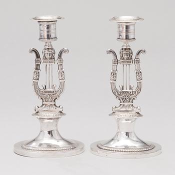 A pair of silver candlesticks marked Adolf Zethelius, Stockholm, 1816.