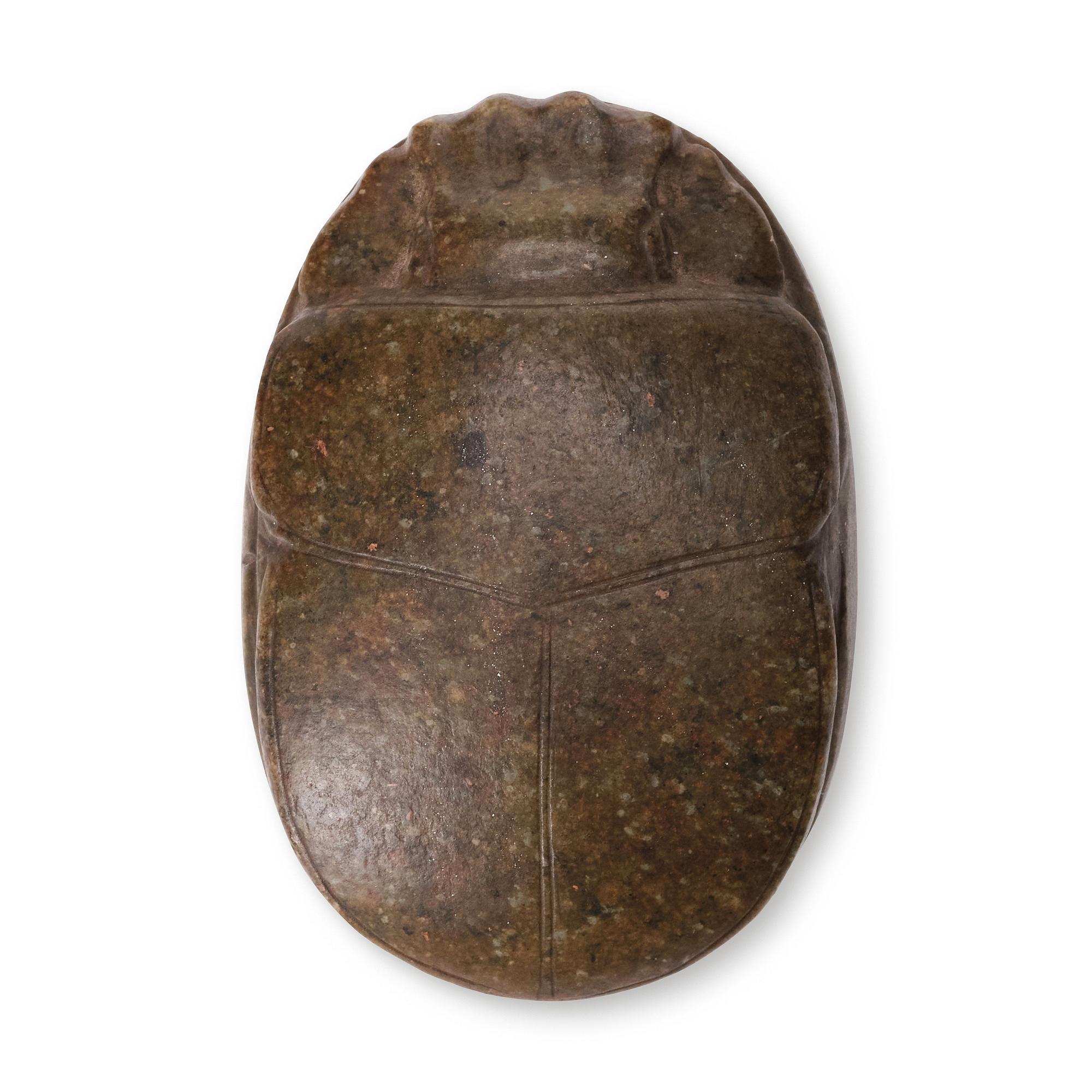 An Egyptian hardstone funerary scarab, probably Late Period, 26th-30th Dynasties, circa 664-343 B.C.