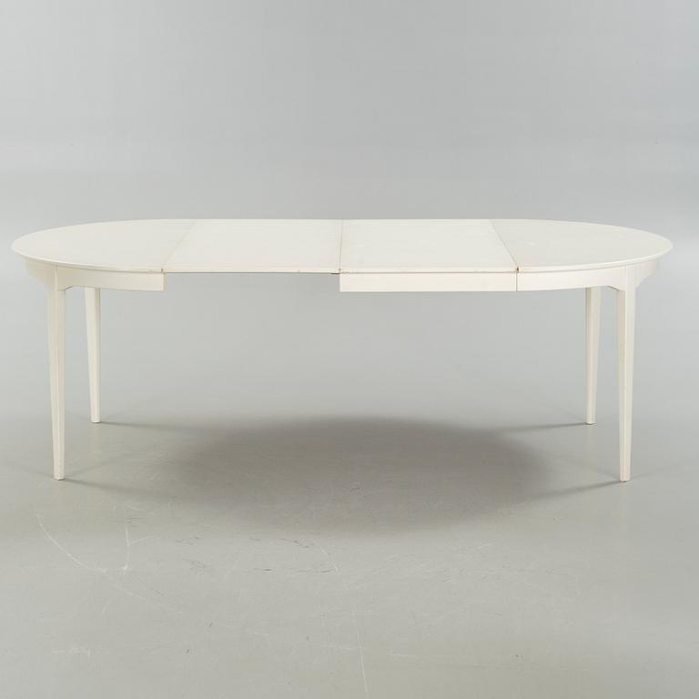 A dining table and six chairs, chairs by Carl Malmsten, model "Herrgården", second half of the 20th century.