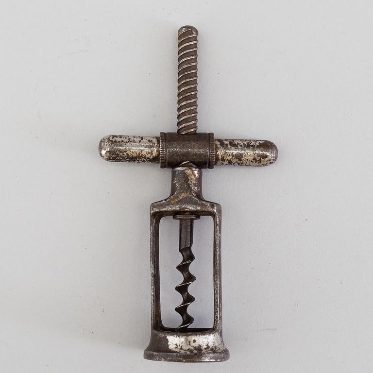 FOUR CAST IRON CORK SCREWS, 19th century.