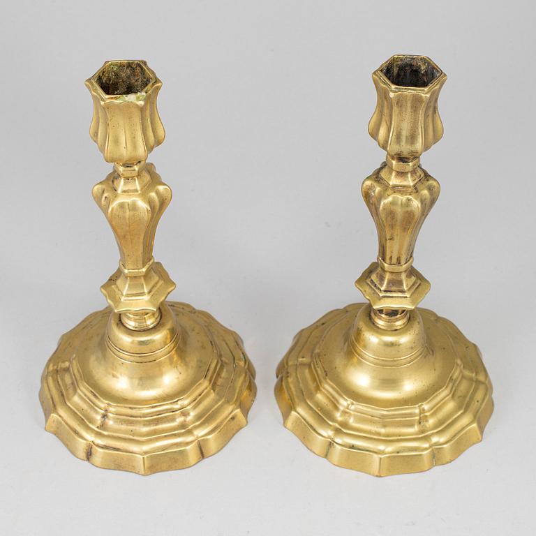 A pair of 18th century bronze candlesticks.