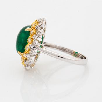 Cabochon-cut emerald and brilliant-cut diamond ring.
