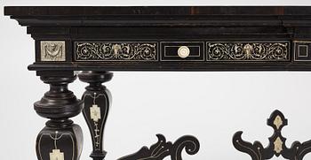 A Renaissance-style ebony, ebonized and ivory-inlaid library table, late 19th century, presumably Germany.