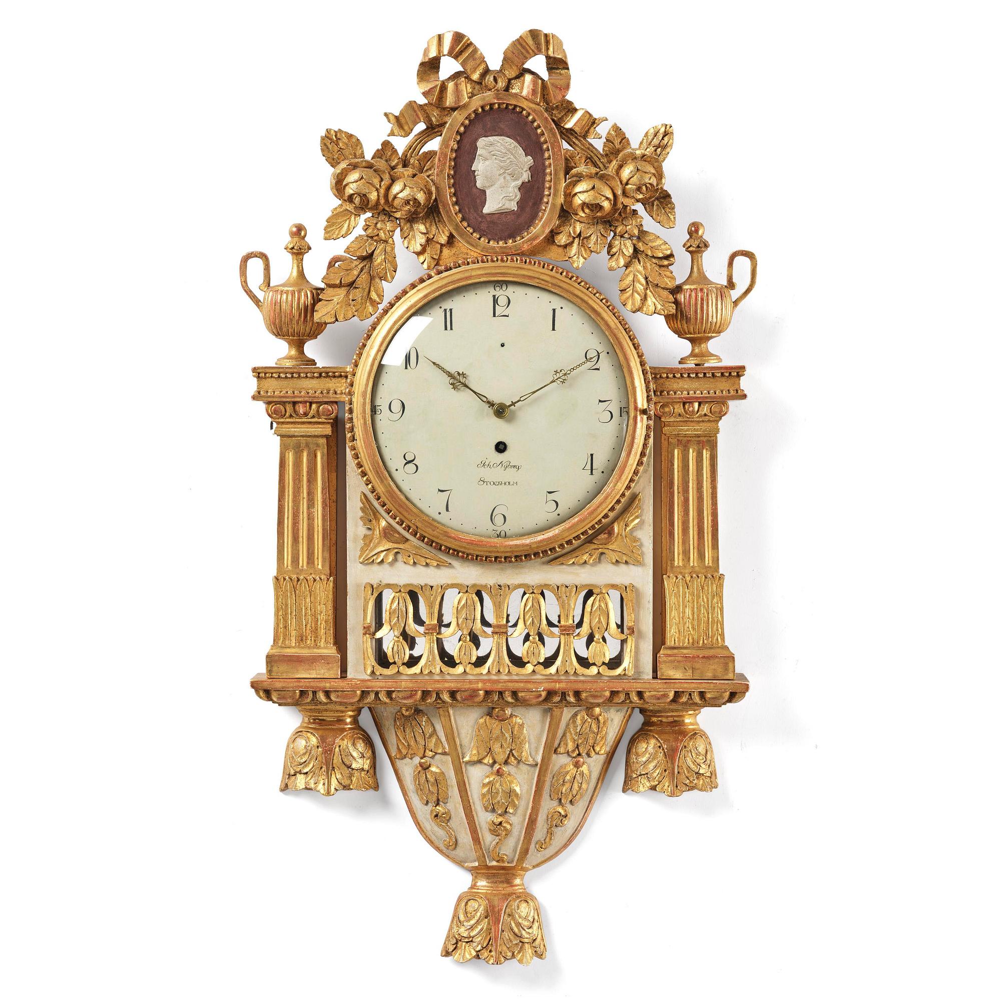 A late Gustavian giltwood cartel clock by J. Nyberg (master in Stockholm 1787-1801).