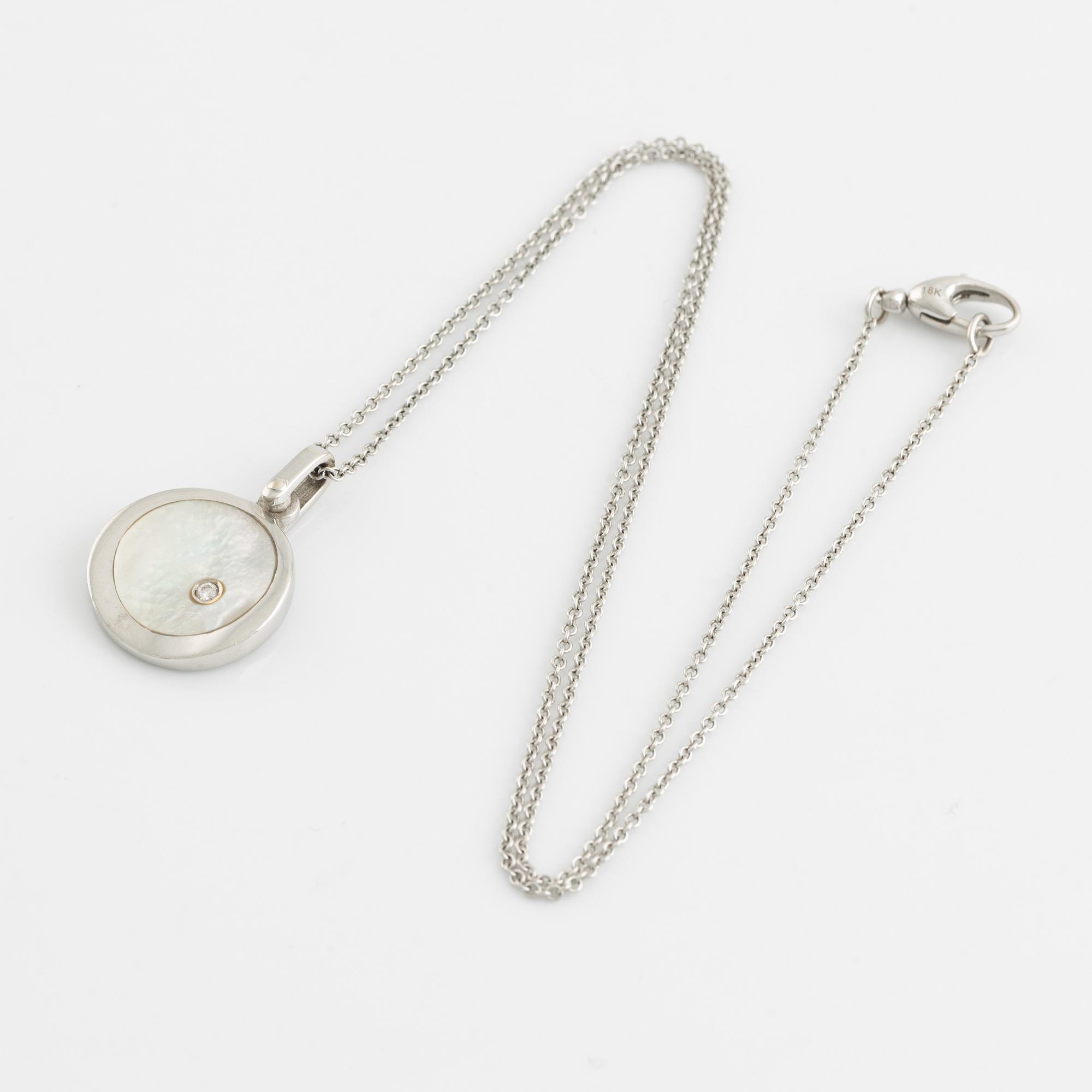 White gold, mother of pearl and round brilliant cut diamond necklace.