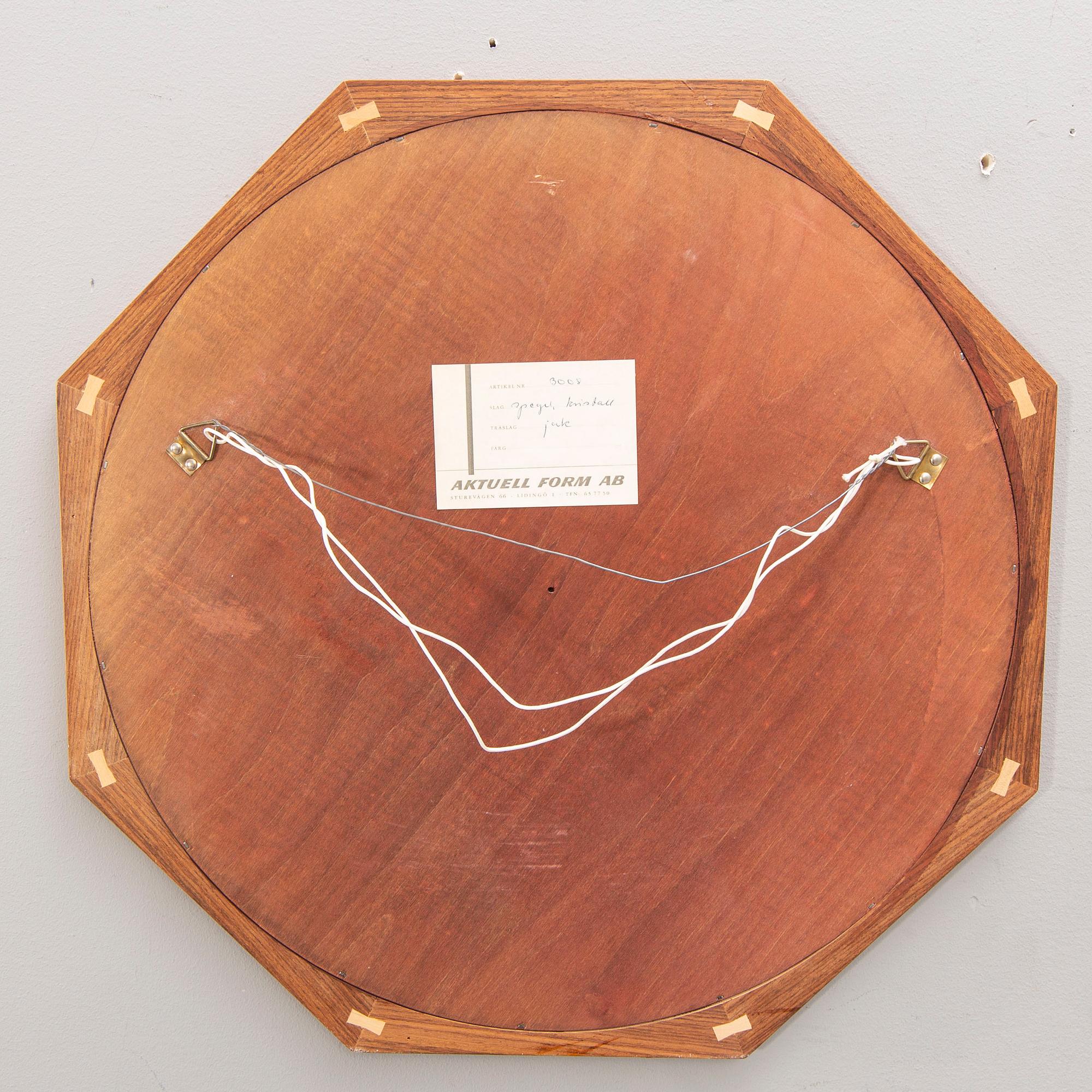 A Sigvard Bernadotte jacaranda mirror for Aktuell Form later part of the 20th century.