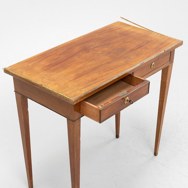 A late Gustavian style mahogany table with drawers.