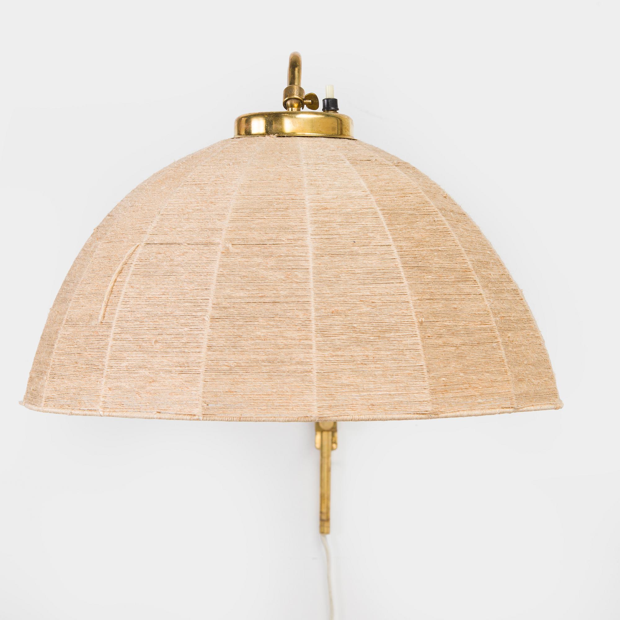 A mid-20th century wall light for Valinte, Finland.