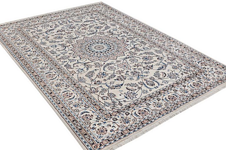 A carpet, Nain, part silk, 9 laa, c. 345 x 246 cm.