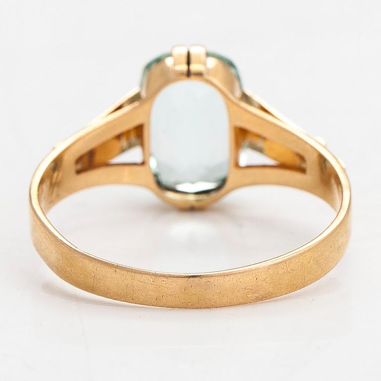 Ring, 18K guld med en akvamarin, Oskar Lindroos, Helsingfors 1917.