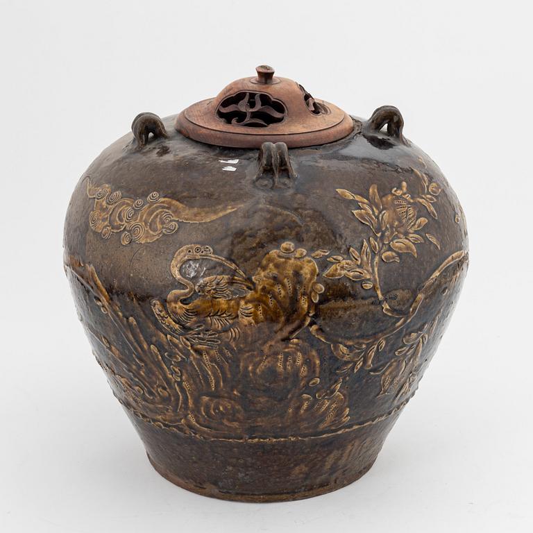 A large brown glazed marthaban jar, presumably late Ming dynasty (1368-1644).