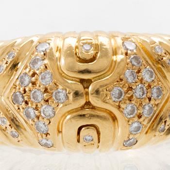 An 18K gold ring set with round brilliant-cut diamonds, London.