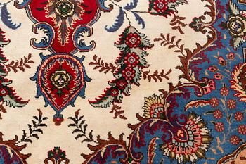An oriental carpet, possibly Tabriz, c. 372 x 268 cm.