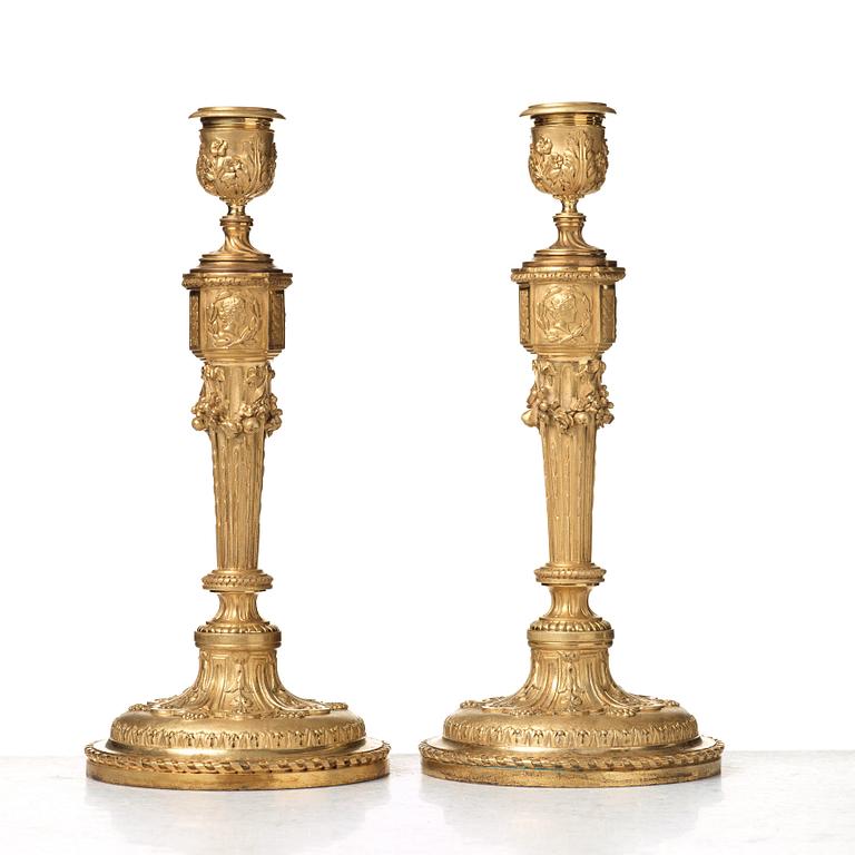 A pair of Louis XVI-style 19th century candlesticks by Raingo Frères, Paris.