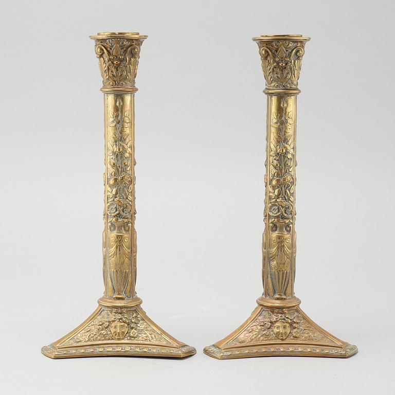 A pair of brass candlesticks from Elkingtons in Birmingham, 19th century.