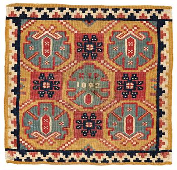 248. A CUSHION, double-interlocked tapestry, ca 54,5 x 57 cm (with mounting 62 x 64 cm), signed and dated KTD 1802. Scania.