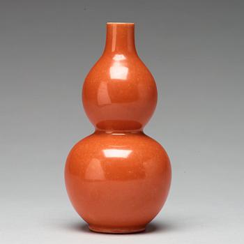 A coral red calebass shaped vase, Qing dynasty with Jiaqing mark (1796-1820).