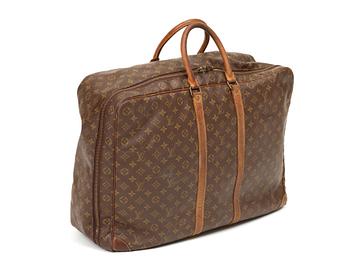 A monogram canvas softsided suitcase by Louis Vuitton.