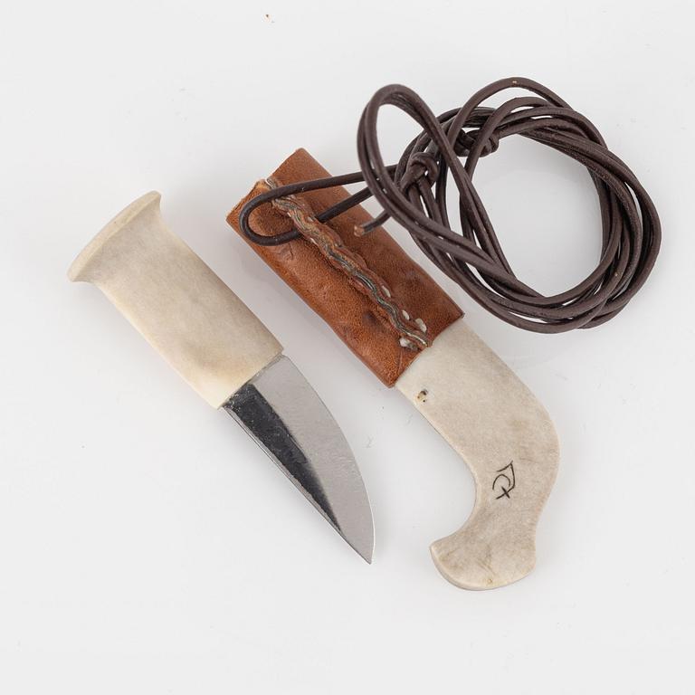 A small reindeer horn knife by Patric Jonsson (?) and a cup by Per Erik Nilsson.