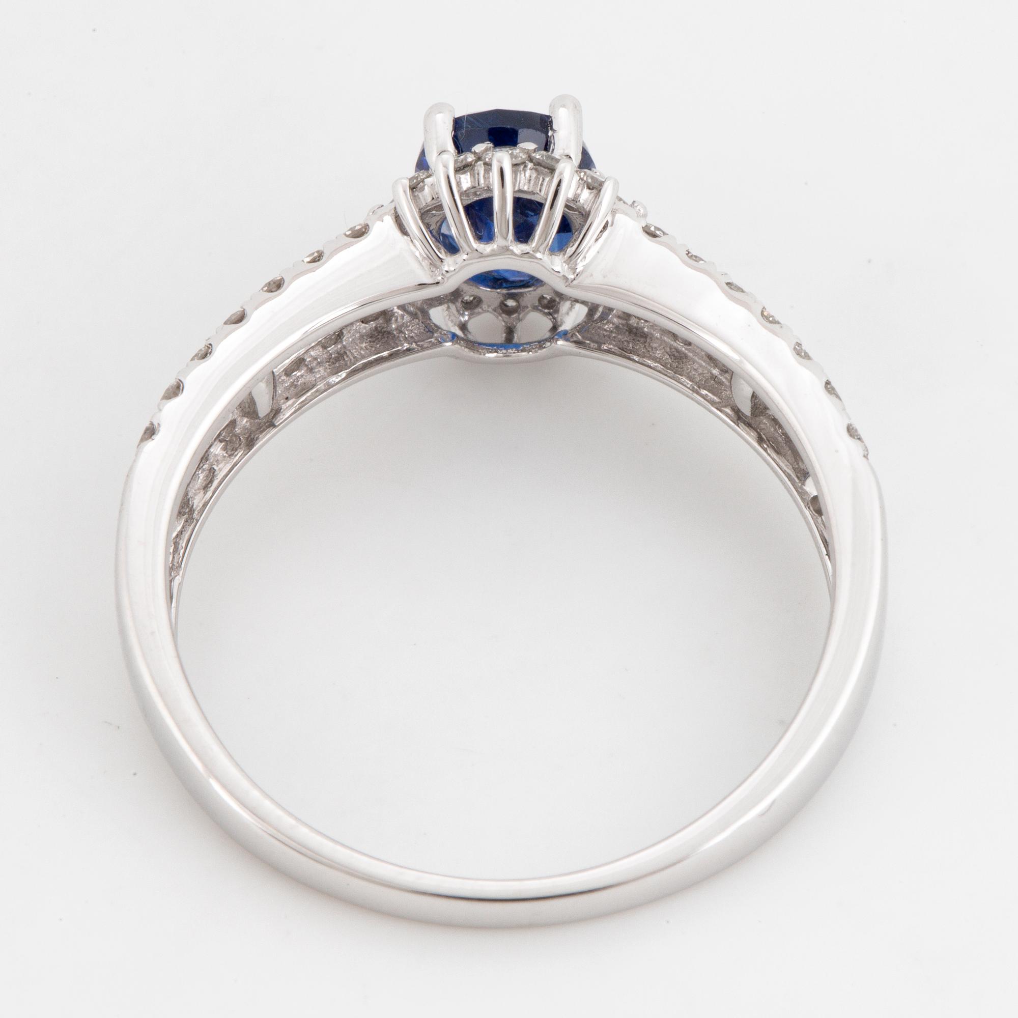 Kyanite and brilliant-cut diamond ring.
