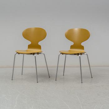 BRUNO MATHSSON & PIET HEIN, and ARNE JACOBSEN, a 'Supercirkel' table and two 'Myran' chairs, from Fritz Hansen.
