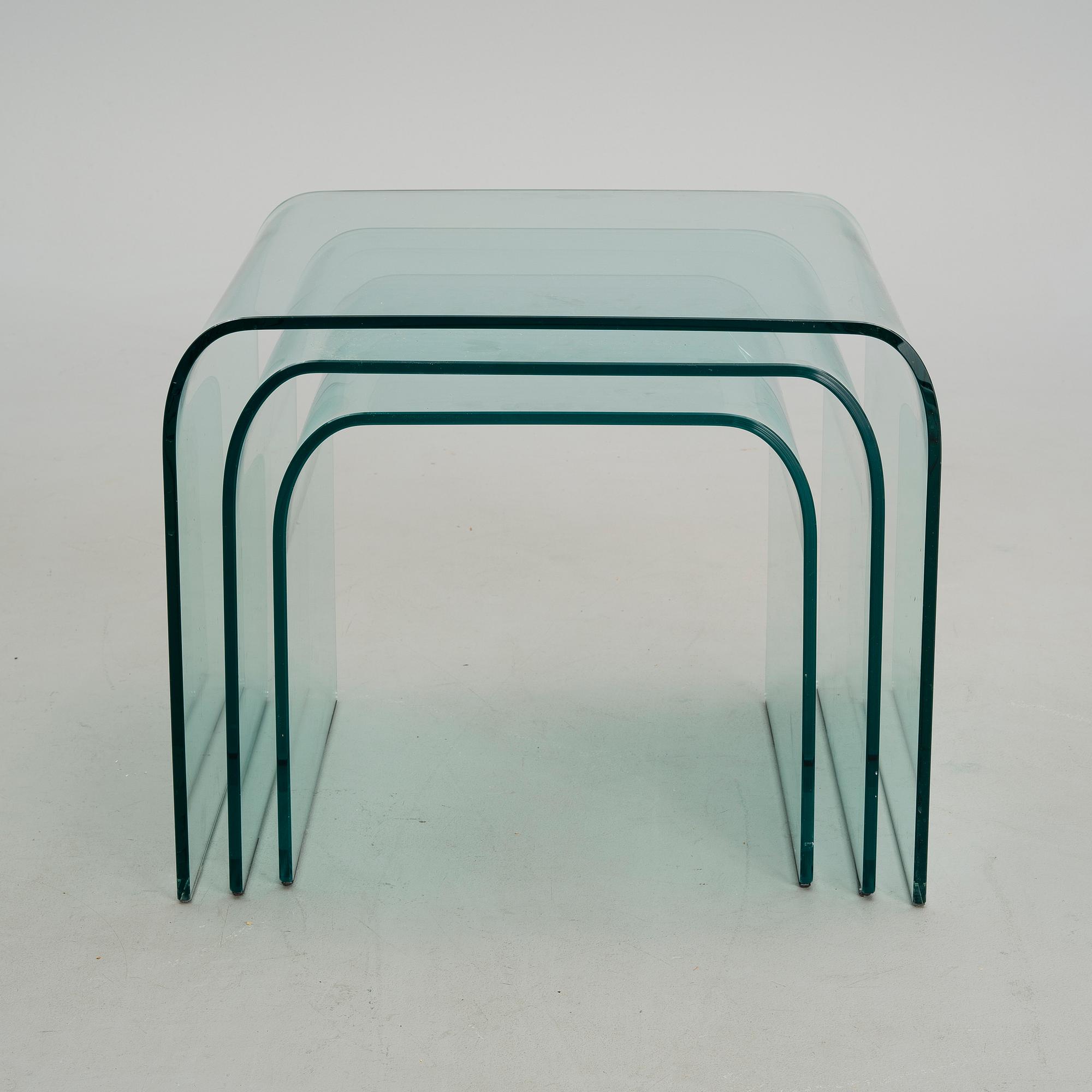 A GLASS NEST TABLE / GLASS COFFEE TABLE, "Eclipse" Ligne Roset, retailer Skanno Finland late 20th century.