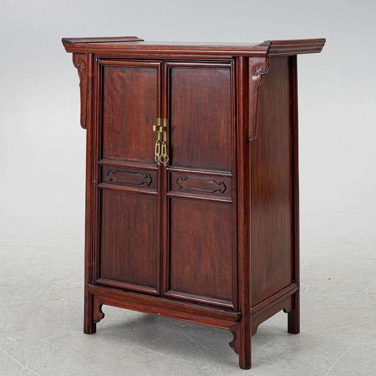 A small Chinese wooden cabinet, 1900s.