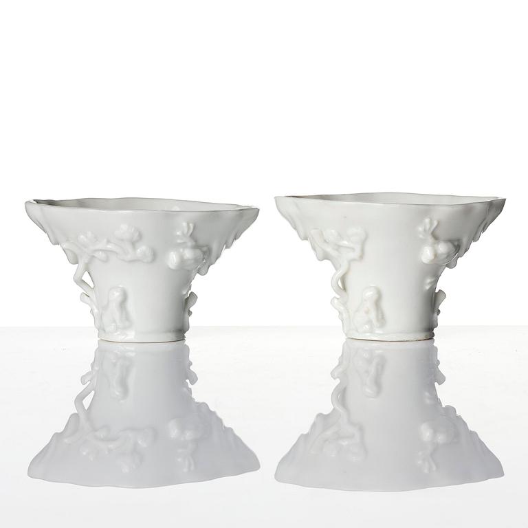 Two blanc de chine rhinoceros libation cups, Qing dynasty, Kangxi (1662-1722).
