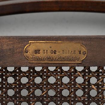 A pair of stained birch armchairs, and a pair of chairs, 'Harding' Nordiska Kompaniet, first half of the 20th Century.