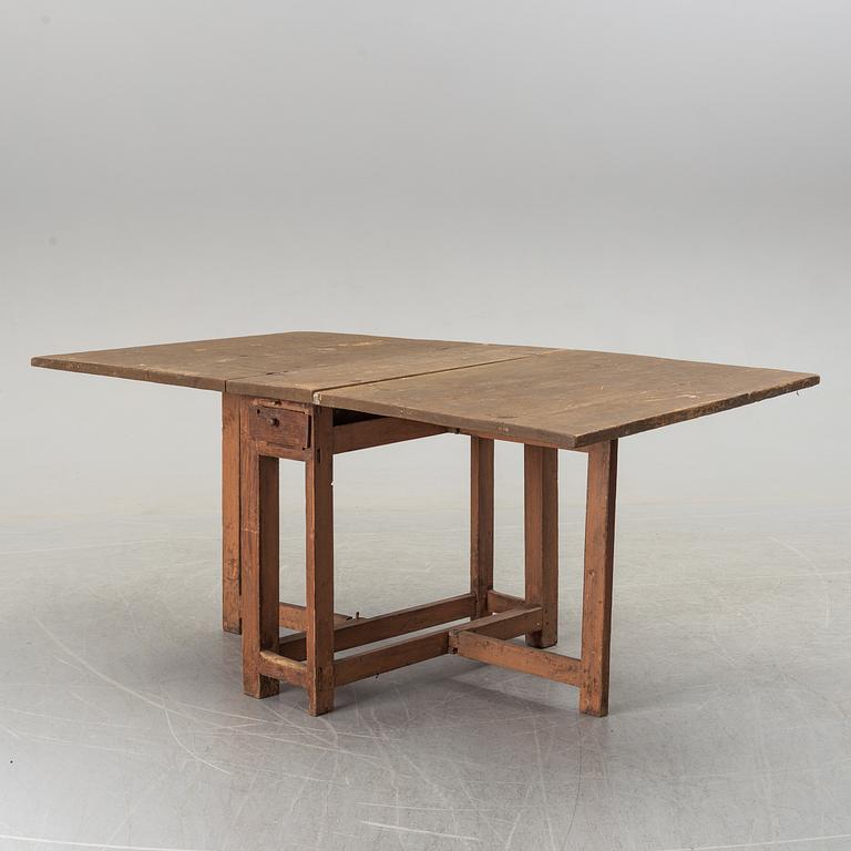 A 19th century painted gate leg table.