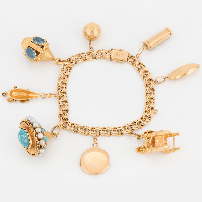 18K gold charm bracelet.