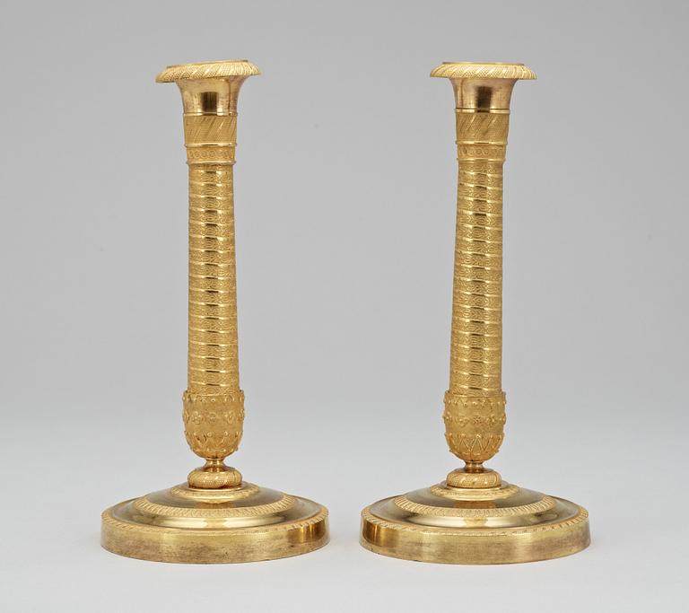 A pair of French Empire early 19th Century candlesticks.