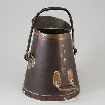 A copper pitcher, circa 1800.