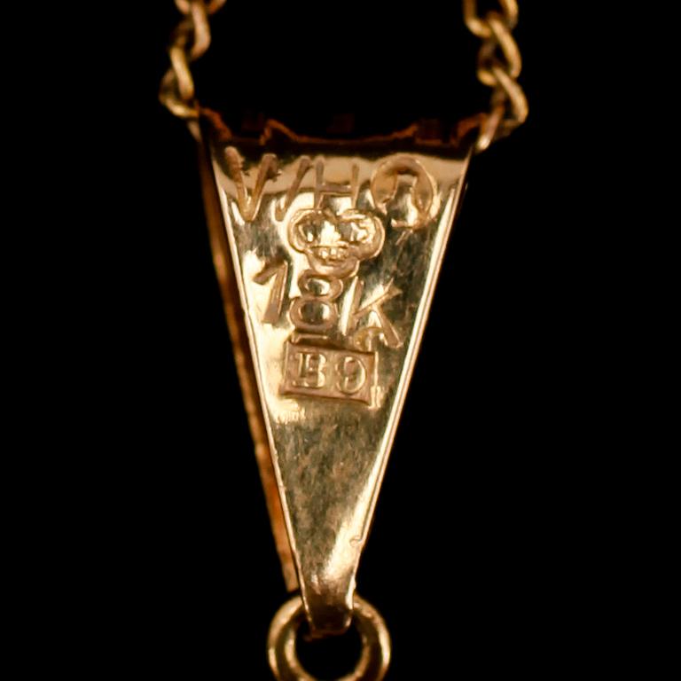COLLIER, 18 k guld, med bergkristall, 1952. Tot vikt 5 g.