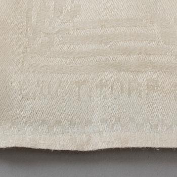 A TABLE CLOTH, linen damask, "Ymnighetshornet", ca 294 x 148 cm, signed C.W. T:tORP SVERIGE.