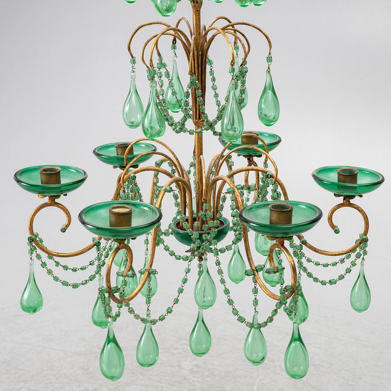 A chandelier, likely from Italy, circa 1950.