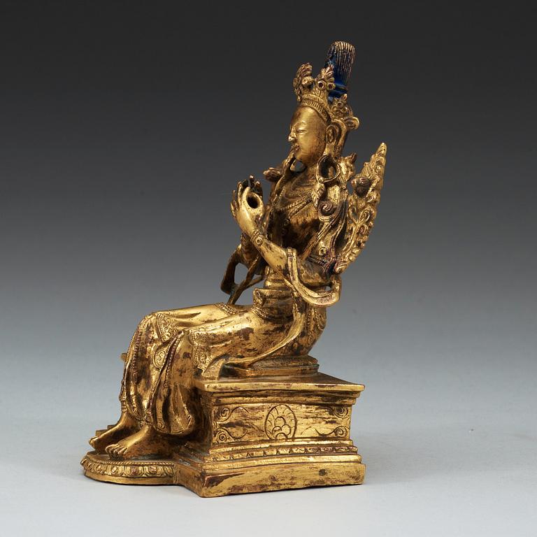 A Sino-Tibetan gilt bronze figure of Maitreya.