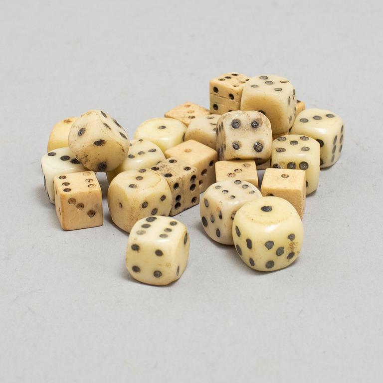 A set of 24 19th century miniature bone and stone dice.