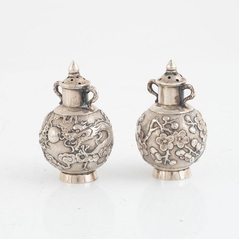 A pair of Chinese silver shakers, late Qing dynasty.