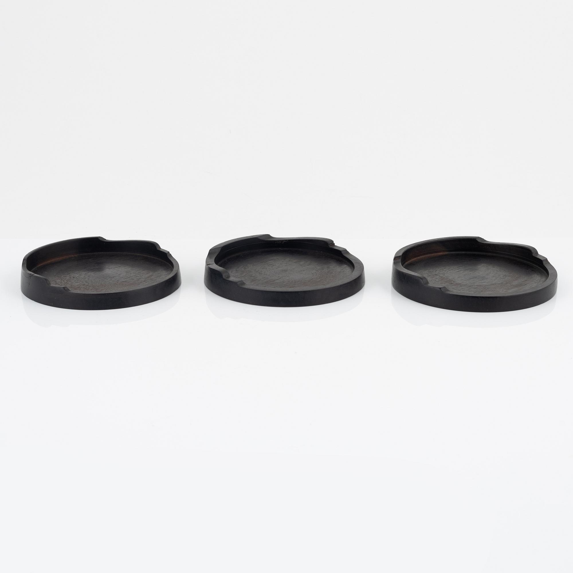Magnus Ek, a set of five ebony coasters for Oaxen Krog.