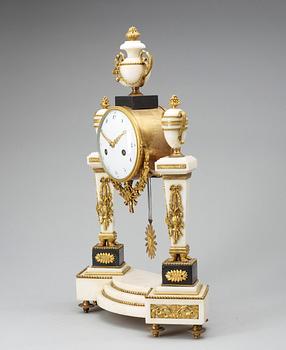 A Louis XVI late 18th century gilt bronze and marble mantel clock.