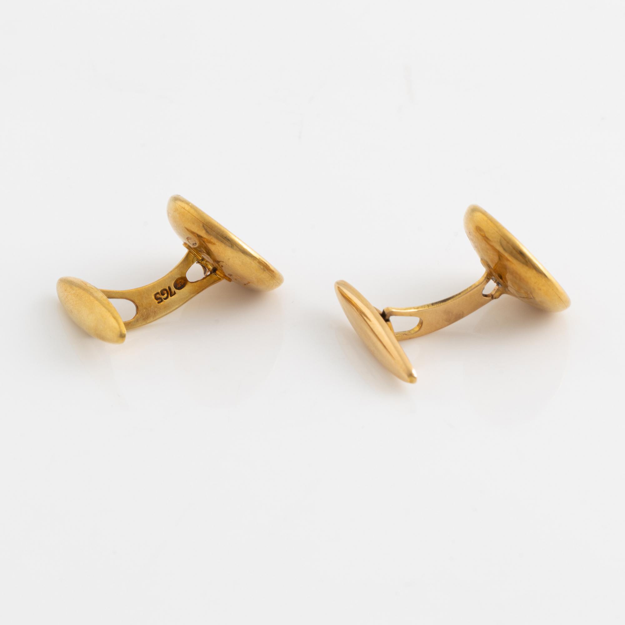 Ett par manschettknappar 18K guld med pärlemor.