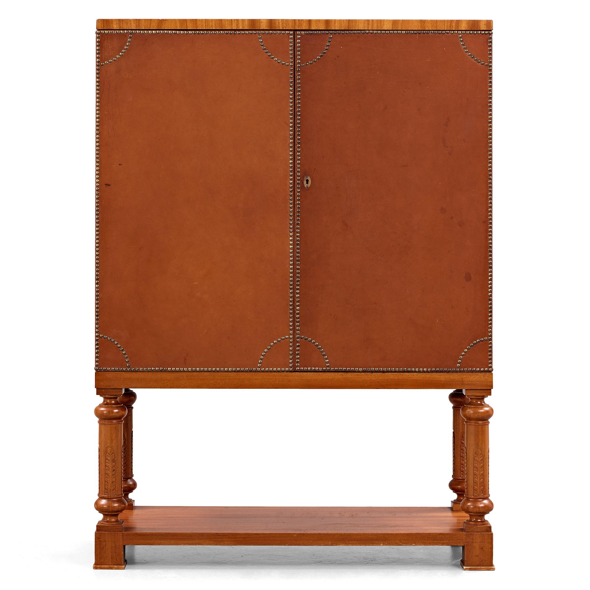 Otto Schulz, Boet, Gothenburg, probably, a cabinet covered with brown leather, dated 1942.