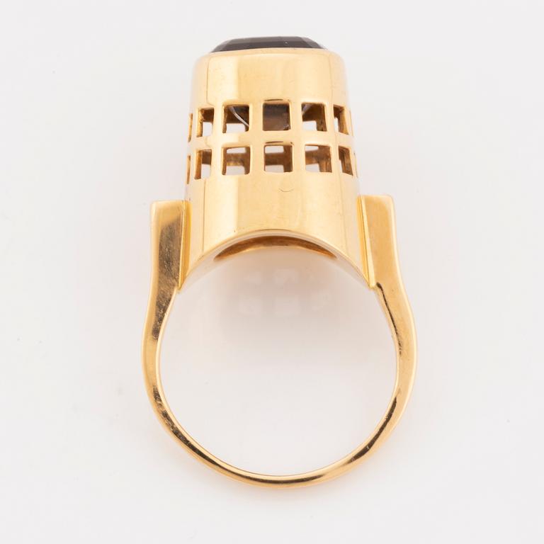 An 18K gold and smoke quartz Sigurd Persson ring.