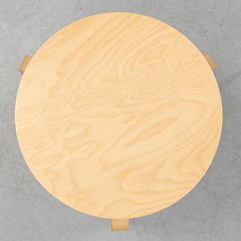 A bench and a stool by Alvar Aalto, from around the year 2000.
